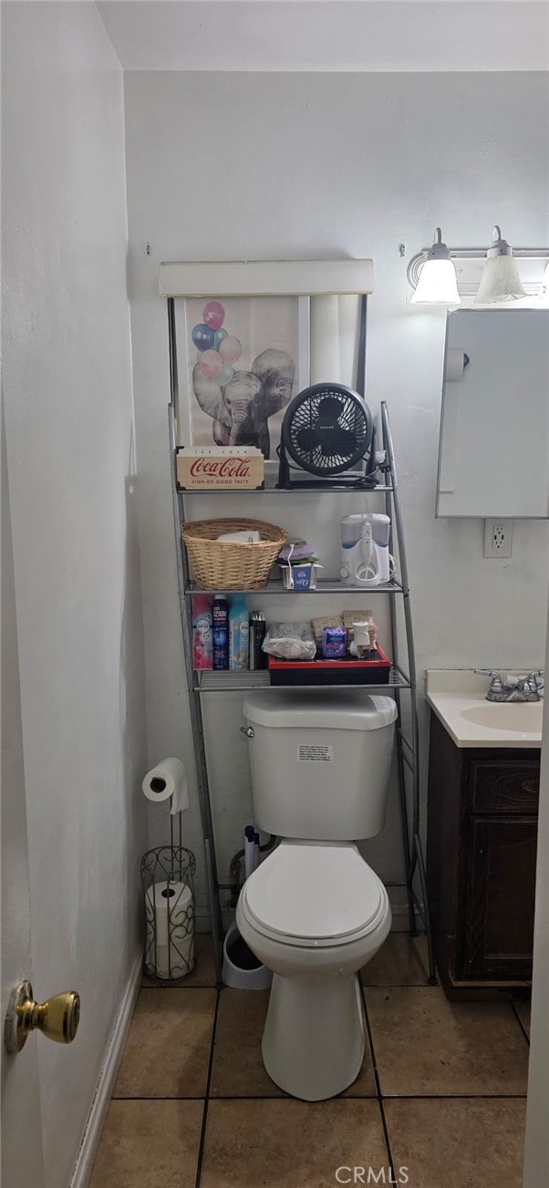 8014 Morton Ave, Los Angeles, CA 90001 - half bathroom with vanity and tile patterned floors