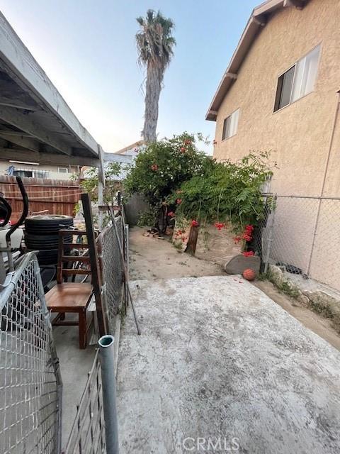8014 Morton Ave, Los Angeles, CA 90001 - view of home's exterior featuring stucco siding and a patio