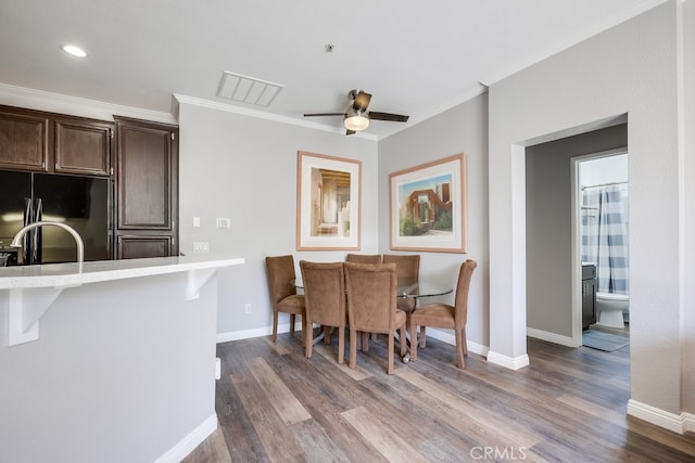 376 Gullotti Pl, Placentia, CA 92870 - dining space featuring dark wood-style floors, a ceiling fan, crown molding, and recessed lighting