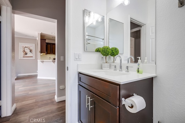 376 Gullotti Pl, Placentia, CA 92870 - bathroom featuring vanity, wood finished floors, and crown molding