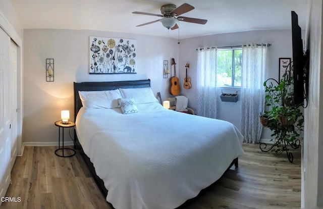 21613 Mountain Dr, Tehachapi, CA 93561 - bedroom featuring wood finished floors, a closet, and ceiling fan