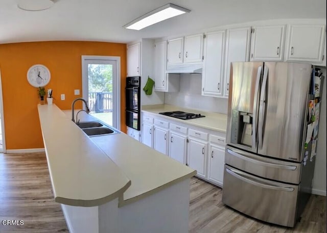 21613 Mountain Dr, Tehachapi, CA 93561 - kitchen featuring black appliances, white cabinetry, light wood-type flooring, and light countertops