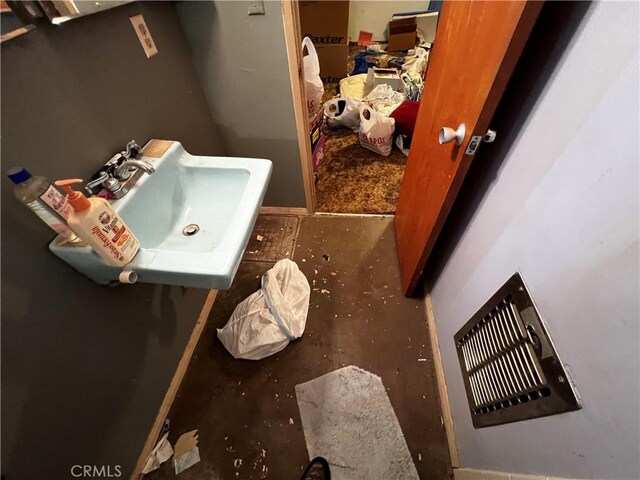12449 6th St, Yucaipa, CA 92399 - bathroom featuring concrete flooring and a sink