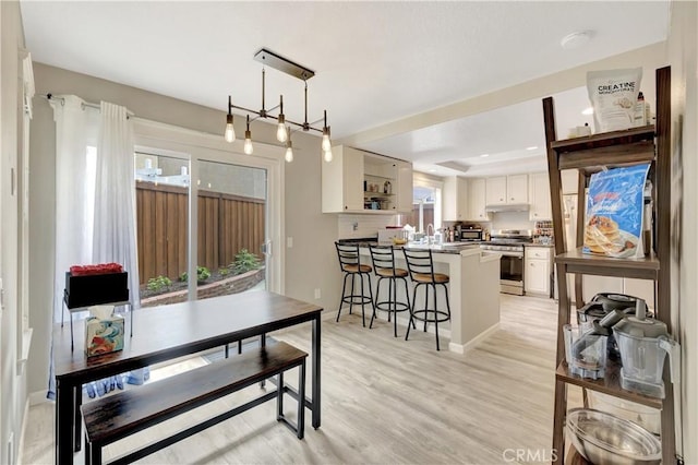 30042 Oceanus, Laguna Niguel, CA 92677 - dining space with light wood-type flooring and a tray ceiling