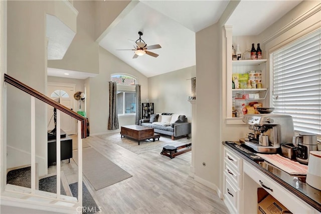 30042 Oceanus, Laguna Niguel, CA 92677 - interior space featuring a ceiling fan, stairway, vaulted ceiling, and light wood-style flooring
