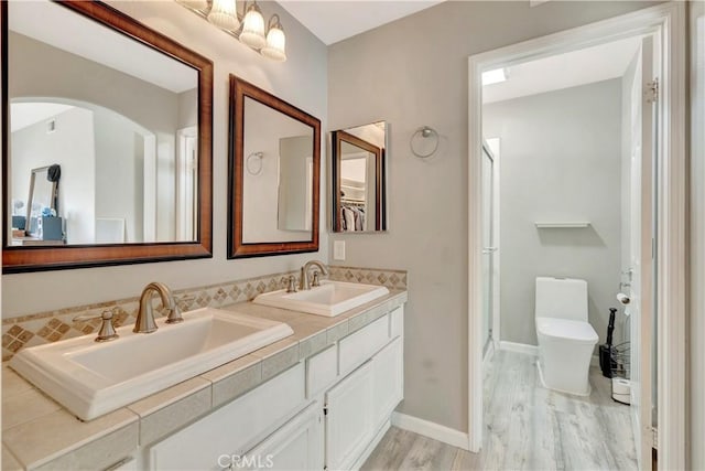 30042 Oceanus, Laguna Niguel, CA 92677 - full bath with double vanity, wood finished floors, and a shower with door