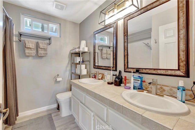 30042 Oceanus, Laguna Niguel, CA 92677 - bathroom with double vanity, healthy amount of natural light, and curtained shower