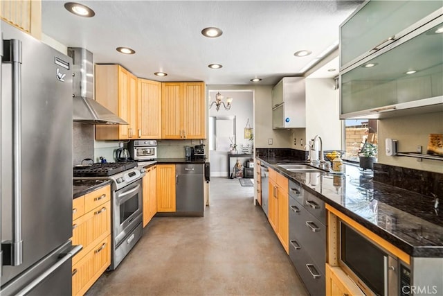 36536 Jenna Ln, Palmdale, CA 93550 - kitchen with appliances with stainless steel finishes, wall chimney range hood, light brown cabinets, concrete flooring, and recessed lighting