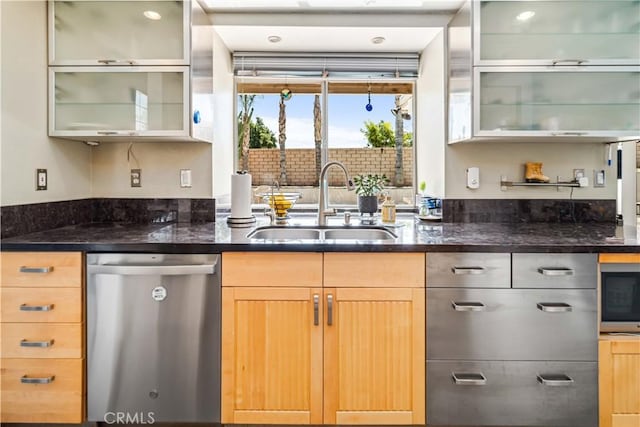 36536 Jenna Ln, Palmdale, CA 93550 - kitchen featuring stainless steel appliances, dark stone counters, glass insert cabinets, and light brown cabinetry