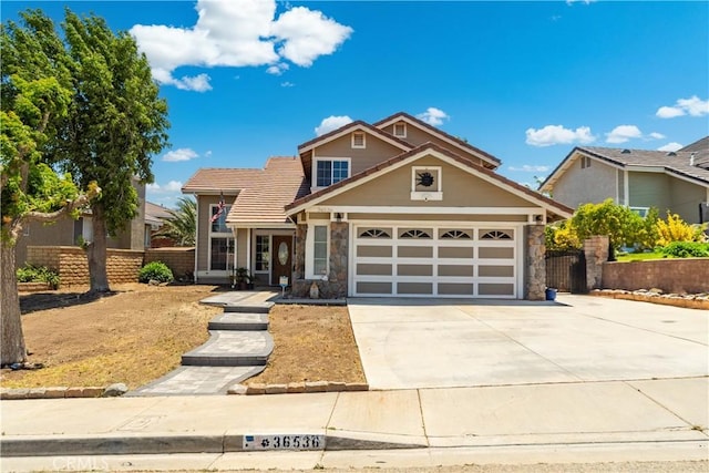 36536 Jenna Ln, Palmdale, CA 93550 - view of front facade featuring stone siding, driveway, a garage, and a tile roof
