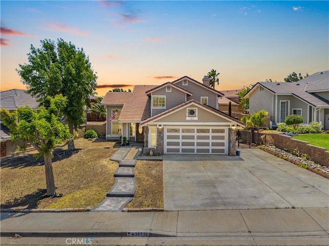 36536 Jenna Ln, Palmdale, CA 93550 - view of front facade featuring stone siding, a garage, and driveway