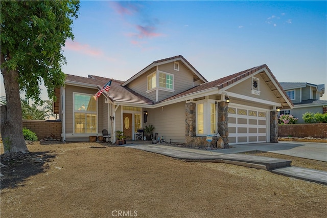 36536 Jenna Ln, Palmdale, CA 93550 - traditional home with driveway, an attached garage, and stone siding