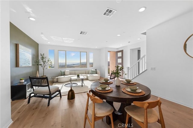 3173 Ivy Way, Rancho Mission Viejo, CA 92694 - dining space with light wood-style flooring, recessed lighting, and stairway