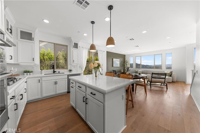 3173 Ivy Way, Rancho Mission Viejo, CA 92694 - kitchen with recessed lighting, open floor plan, a center island, white cabinets, and hanging light fixtures