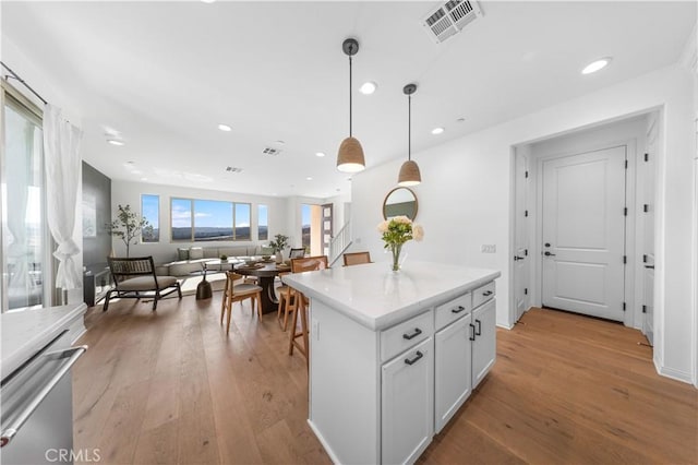 3173 Ivy Way, Rancho Mission Viejo, CA 92694 - kitchen featuring light wood-style floors, recessed lighting, pendant lighting, dishwasher, and light countertops
