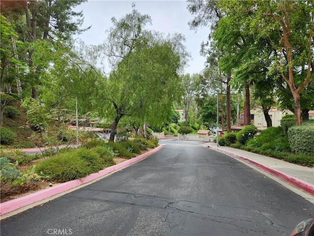 22790 Lakeway Dr Unit 461, Diamond Bar, CA 91765 - view of asphalt road with curbs, sidewalks, and street lights