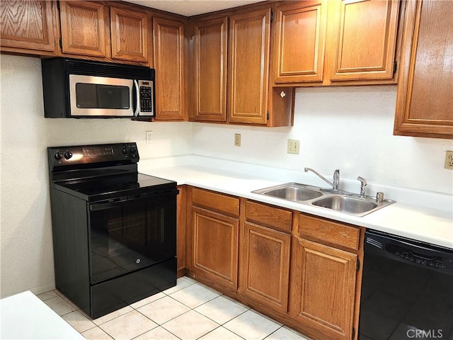 22790 Lakeway Dr Unit 461, Diamond Bar, CA 91765 - kitchen featuring black appliances, light countertops, brown cabinetry, and light tile patterned floors
