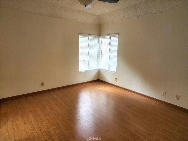 22790 Lakeway Dr Unit 461, Diamond Bar, CA 91765 - unfurnished room with light wood-style floors, a ceiling fan, and a textured ceiling