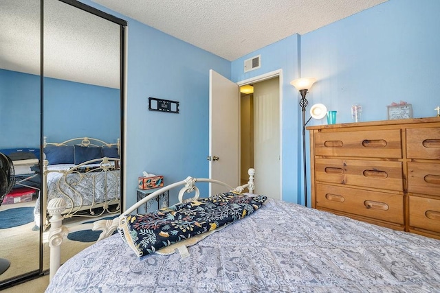 44668 13th St E, Lancaster, CA 93535 - bedroom with a textured ceiling, a closet, and carpet floors