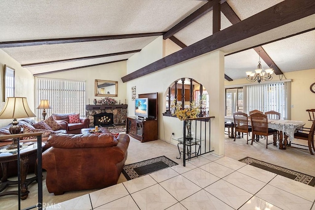44668 13th St E, Lancaster, CA 93535 - living area with a textured ceiling, a chandelier, light carpet, and a fireplace