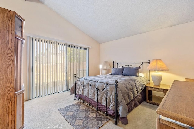 44668 13th St E, Lancaster, CA 93535 - carpeted bedroom with vaulted ceiling, access to exterior, and a textured ceiling