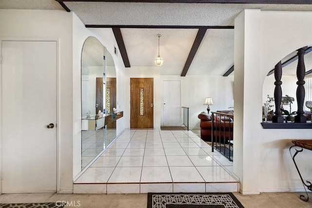 44668 13th St E, Lancaster, CA 93535 - carpeted foyer featuring a textured ceiling and arched walkways