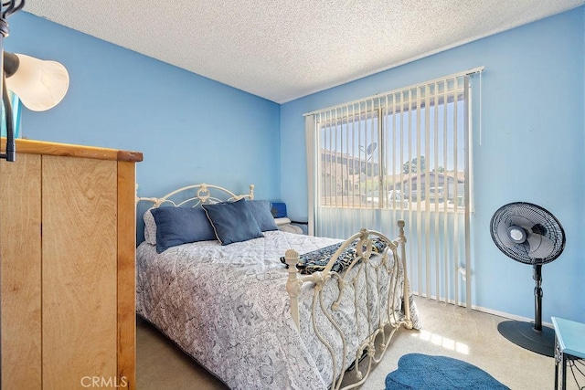 44668 13th St E, Lancaster, CA 93535 - carpeted bedroom with a textured ceiling and baseboards