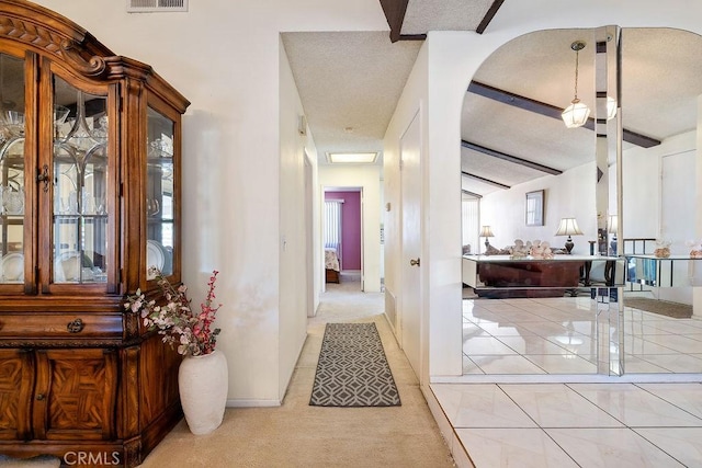 44668 13th St E, Lancaster, CA 93535 - corridor featuring light carpet, healthy amount of natural light, beamed ceiling, and light tile patterned floors