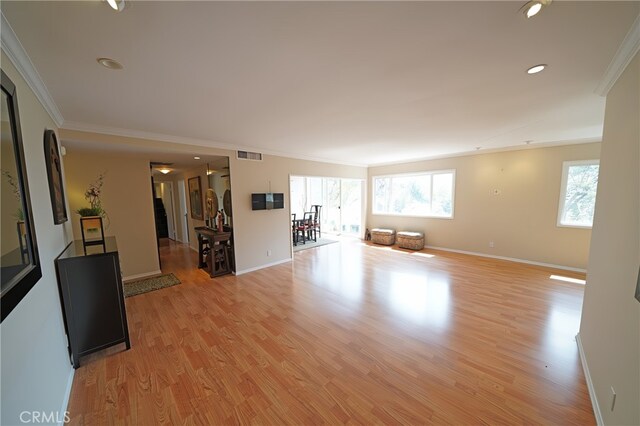 1525 N Hayworth Ave Unit 304, Los Angeles, CA 90046 - unfurnished living room with ornamental molding, light wood-style flooring, and recessed lighting