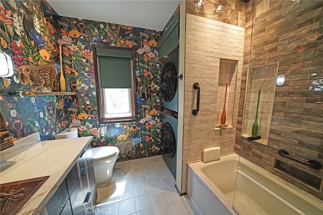 1525 N Hayworth Ave Unit 304, Los Angeles, CA 90046 - bathroom with stacked washing machine and dryer, wallpapered walls, vanity, tile patterned floors, and washtub / shower combination
