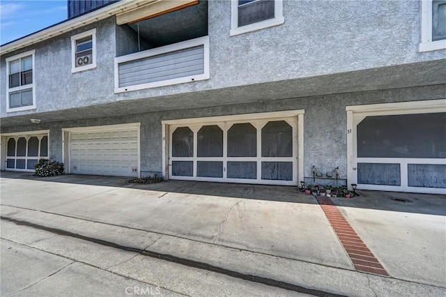 13303 Waco St Unit 32, Baldwin Park, CA 91706 - property entrance with stucco siding and concrete driveway