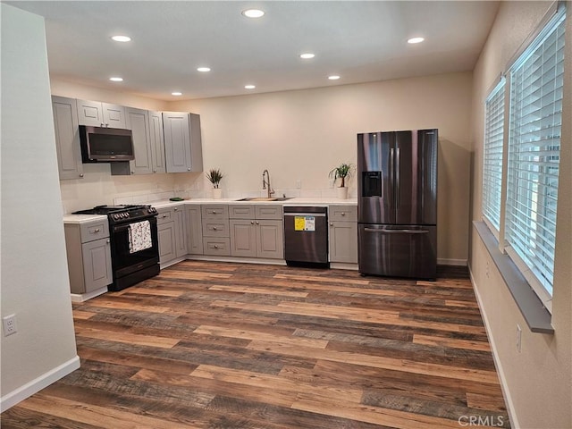 8463 California Ave, Riverside, CA 92504 - kitchen with appliances with stainless steel finishes, gray cabinetry, light countertops, recessed lighting, and dark wood finished floors