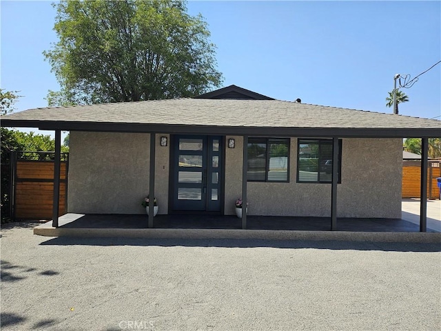 8463 California Ave, Riverside, CA 92504 - view of front of house with stucco siding and a shingled roof