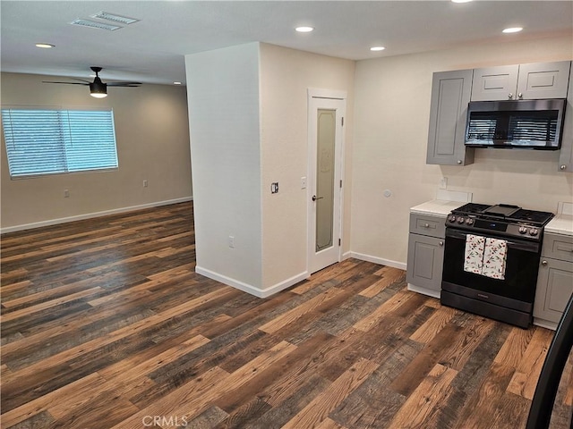 8463 California Ave, Riverside, CA 92504 - kitchen with stainless steel appliances, gray cabinetry, dark wood-style flooring, light countertops, and a ceiling fan