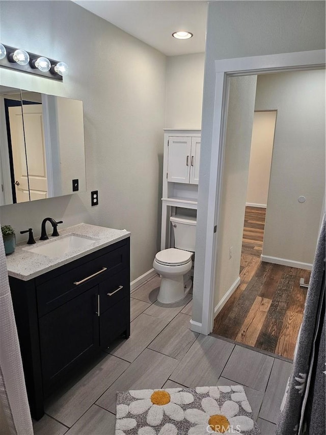 8463 California Ave, Riverside, CA 92504 - bathroom featuring wood finish floors and vanity
