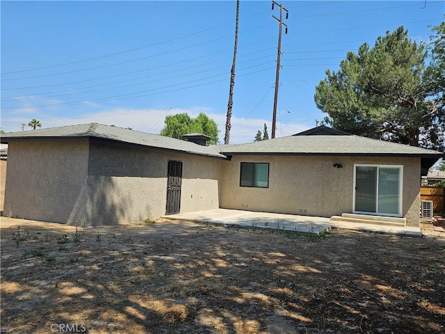 8463 California Ave, Riverside, CA 92504 - rear view of property featuring stucco siding and a patio