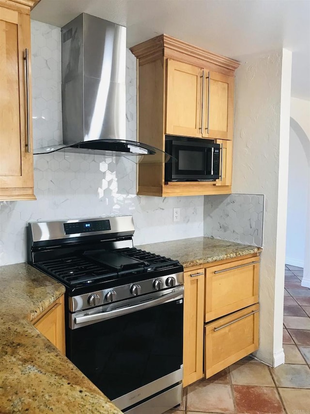 1230 Ramona Ave, Spring Valley, CA 91977 - kitchen featuring stainless steel range with gas stovetop, black microwave, wall chimney exhaust hood, decorative backsplash, and light stone countertops