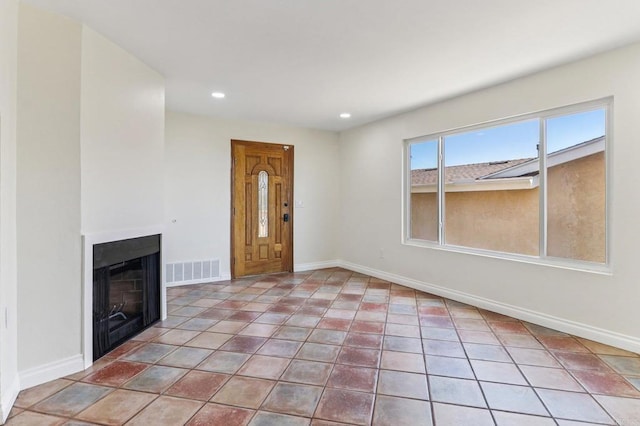 1230 Ramona Ave, Spring Valley, CA 91977 - unfurnished living room featuring a fireplace, recessed lighting, and light tile patterned flooring