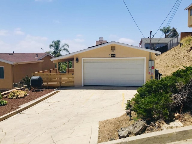 1230 Ramona Ave, Spring Valley, CA 91977 - view of front of property with concrete driveway, stucco siding, and a chimney