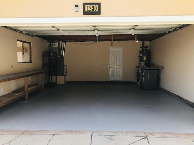 1230 Ramona Ave, Spring Valley, CA 91977 - garage featuring washer and dryer, water heater, and heating unit