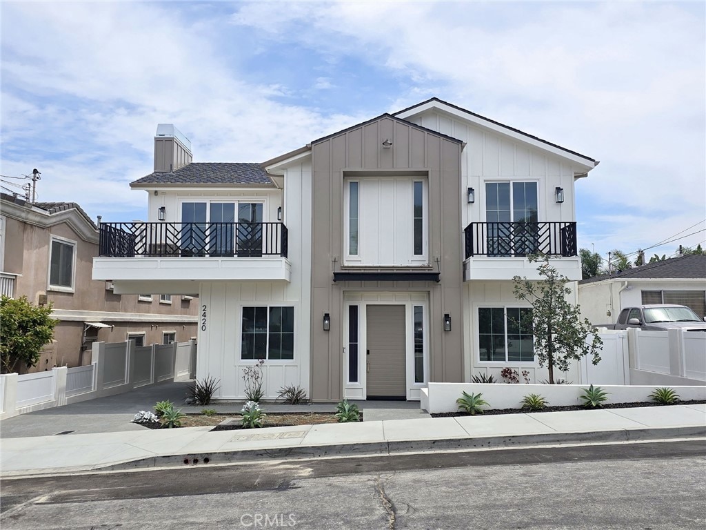 2420 Ives Ln Unit A, Redondo Beach, CA 90278 - view of front of property featuring a balcony, board and batten siding, and a chimney