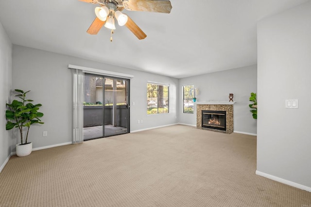 15032 Avenida Venusto Unit 179, San Diego, CA 92128 - unfurnished living room with carpet, ceiling fan, and a fireplace with flush hearth