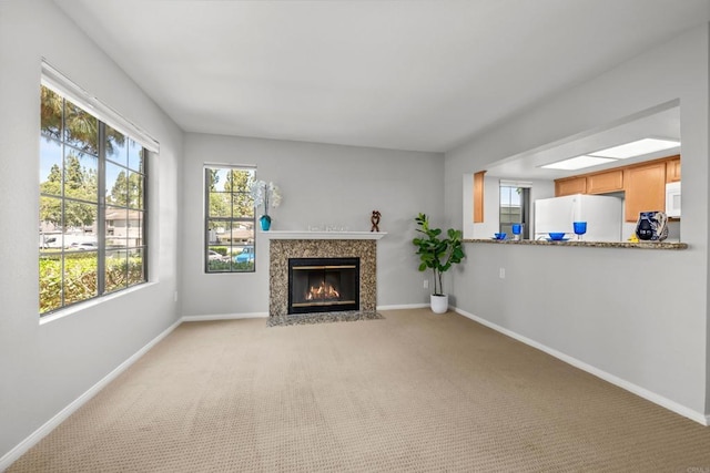 15032 Avenida Venusto Unit 179, San Diego, CA 92128 - unfurnished living room with a premium fireplace and light carpet
