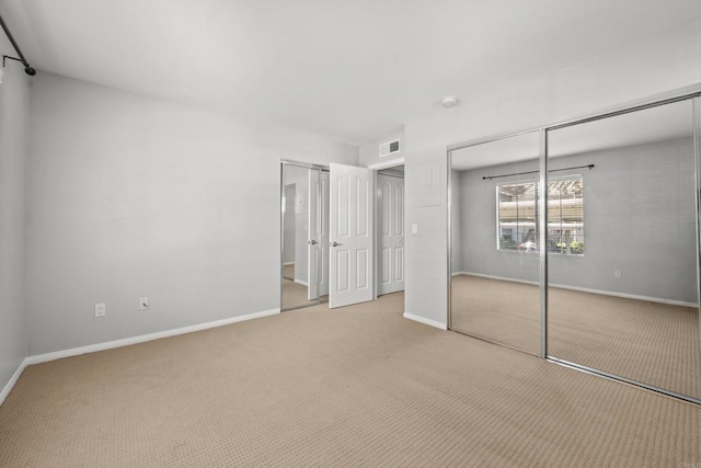 15032 Avenida Venusto Unit 179, San Diego, CA 92128 - unfurnished bedroom with multiple closets and carpet