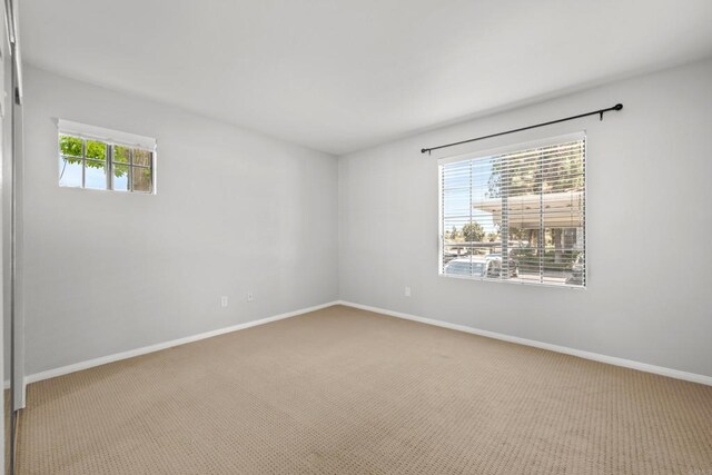 15032 Avenida Venusto Unit 179, San Diego, CA 92128 - carpeted empty room with baseboards