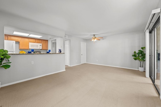 15032 Avenida Venusto Unit 179, San Diego, CA 92128 - unfurnished living room with light colored carpet and ceiling fan