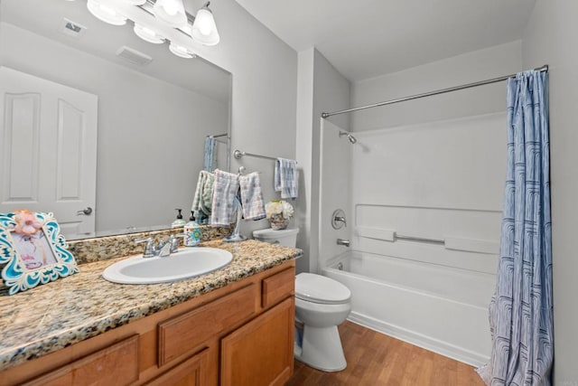 15032 Avenida Venusto Unit 179, San Diego, CA 92128 - bathroom with shower / bath combo with shower curtain, vanity, and wood finished floors