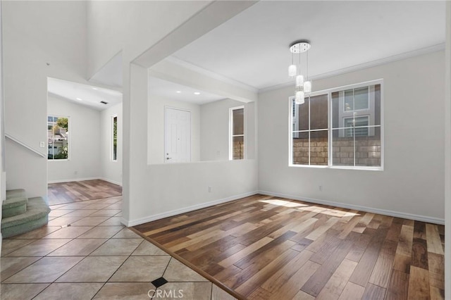24058 Via Vis, Valencia, CA 91354 - tiled spare room featuring ornamental molding, recessed lighting, and stairway