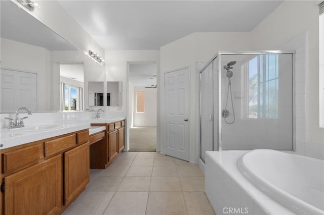 24058 Via Vis, Valencia, CA 91354 - bathroom with a bath, a stall shower, double vanity, tile patterned floors, and a ceiling fan