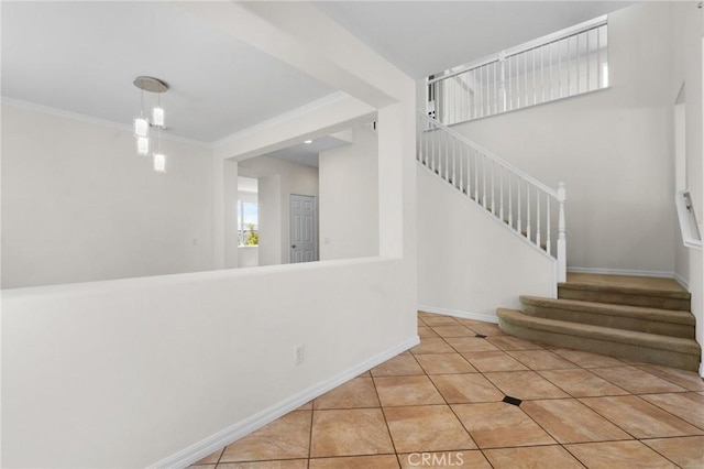 24058 Via Vis, Valencia, CA 91354 - stairs featuring tile patterned flooring and crown molding